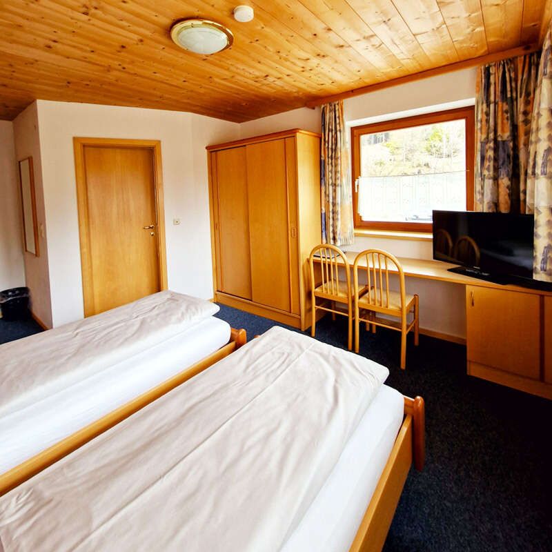 Desk, wardrobe and TV in the Verwall room